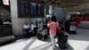 Passengers wait for their flights at Turkey's largest airport, Istanbul Ataturk, following yesterday's blast, June 29, 2016. 