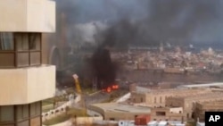 FILE - In this image made from video, the Corinthia Hotel is seen under attack in Tripoli, Libya, Jan. 27, 2015.