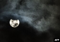 A full moon, or supermoon, is seen during a total lunar eclipse in Cairo early on September 28, 2015. AFP PHOTO