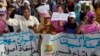 FILE - Mauritanian anti-slavery protesters march to demand the liberation of imprisoned abolitionist leader Biram Ould Abeid in Nouakchott, May 26, 2012.