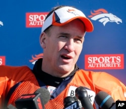 Peyton Manning talks to the media after NFL football practice at the team's training facility in Englewood, Colorado, Jan. 23, 2014.