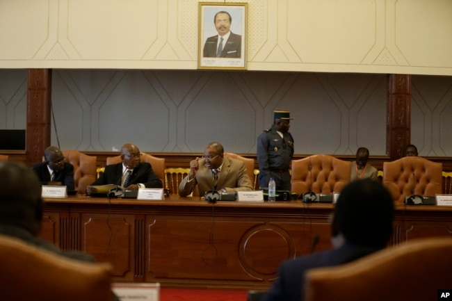 Essombe Emile, President of Cameroon Constitutional Council, center, speaks during a meeting with representatives of the political parties and members of the Electoral commissions in Yaounde, Oct. 10, 2018.