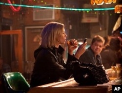 Left to right: Charlize Theron plays Mavis Gary and Patton Oswalt plays Matt Freehauf in YOUNG ADULT, from Paramount Pictures and Mandate Pictures.