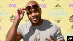 FILE - Flo Rida arrives at the Teen Choice Awards at the Galen Center in Los Angeles. 