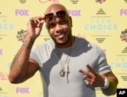 FILE - Flo Rida arrives at the Teen Choice Awards at the Galen Center in Los Angeles.