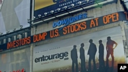 A Dow Jones news ticker in Times Square, NY, carries headlines including reaction to U.S. economy, Aug. 8, 2011