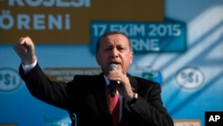 Turkish President Recep Tayyip Erdogan speaks to his supporters during an inauguration for an undersea pipeline to carry fresh water from Turkey to the breakaway Turkish Cypriot north of ethnically split Cyprus in Mirtou village, Oct. 17, 2015. 