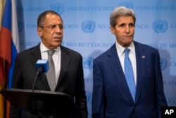 FILE - Russian Foreign Minister Sergei Lavrov, left, speaks during a news conference next to U.S. Secretary of State John Kerry.
