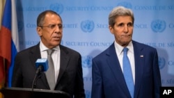 Russian Foreign Minister Sergei Lavrov, left, speaks during a news conference next to U.S. Secretary of State John Kerry at the U.N., Sept. 30, 2015.