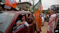 Bharatiya Janata Party (BJP) supporters celebrate their party's win in state assembly elections in Gauhati, Assam state, India, May 19, 2016. India's ruling Hindu nationalist party made dramatic gains in elections in the eastern state.