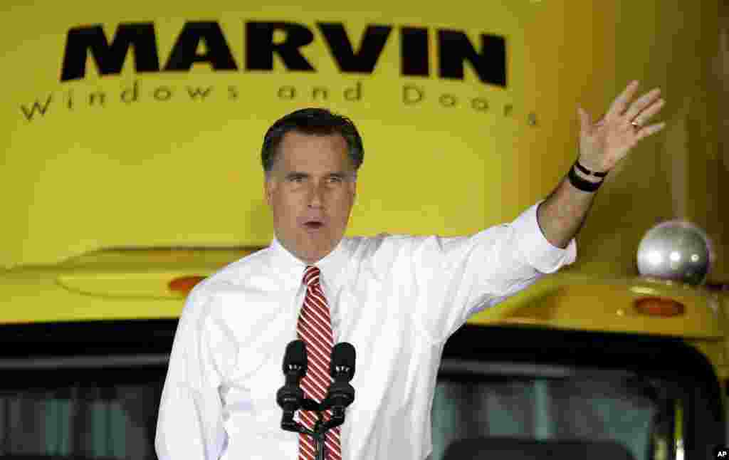 Republican presidential candidate, former Massachusetts Gov. Mitt Romney gestures as he speaks at a campaign event at Integrity Windows in Roanoke, Va., November 1, 2012.