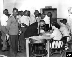 Black Americans register to vote as South Carolina Democrats in Charleston, S.C., July 17, 1948.