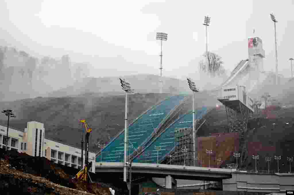 The Olympic ski jump rises from the mountain mists above Sochi, Russia, March 17, 2013. (V. Undritz/VOA) 