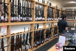 Firearms and accessories are displayed at Gun City gunshop in Christchurch, New Zealand, March 19, 2019.