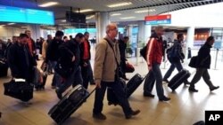 Bulgarian planes carrying Bulgarians and other foreigners - Croats, Serbs and Macedonians, Romanians, Chinese and South Koreans - arrive in Sofia, from Tripoli, Libya, Feb. 23, 2011