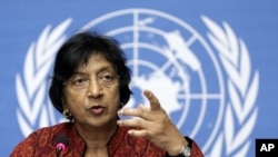 U.N. High Commissioner for Human Rights Navi Pillay gestures during a press conference in Geneva.