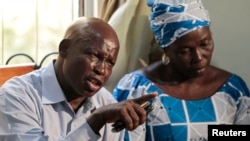 Rev. Enoch Mark, spokesperson for parents of the abducted Chibok schoolgirls, speaks during a meeting of the parents to review efforts to recover the girls, organized by the Chibok Community Association in collaboration with the #BringBackOurGirls group, in Abuja, Jan. 1, 2015.