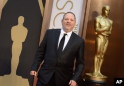 FILE - Harvey Weinstein arrives at the Oscars, March 2, 2014, at the Dolby Theatre in Los Angeles.