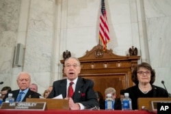 Senate Judiciary Committee Chairman Sen. Charles Grassley, R-Iowa, center, flanked by the committee's ranking member Sen. Dianne Feinstein, D-Calif., right, and Sen. Orrin Hatch, R-Utah, left, speaks on Capitol Hill in Washington, Jan. 10, 2017.