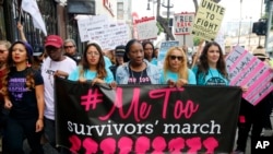 Participants march against sexual assault and harassment at the #MeToo March in the Hollywood section of Los Angeles on Nov. 12, 2017. 