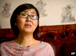 FILE - Wang Yu, a lawyer for Chinese activist Li Tingting, speaks during an interview in Beijing, April 18, 2015