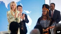 Ivanka Trump, left, the daughter and assistant to President Donald Trump, applauds after listening to a speech made by Francisca Awah Mbuli, right, from Cameroon and survivor of human trafficking, during an event to announce the 2018 Trafficking in Person report.