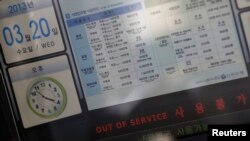 FILE - The screen of an automated teller machine of Shinhan Bank shows a "out of service" sign after a hacking attack, in central Seoul, March 20, 2013.