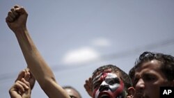 Protesters shout slogans during a demonstration demanding the resignation of President Ali Abdullah Saleh in Sana'a, Yemen, September 17, 2011.