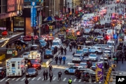 Law enforcement officials work following an explosion near New York's Times Square on Monday, Dec. 11, 2017.