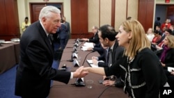 House Minority Whip Steny Hoyer of Maryland, left, greets Farah Al Khafaji, a former Iraqi interpreter for the U.S. military, on Capitol Hill in Washington before a House Democratic forum on President Donald Trump's executive order on immigration, Feb. 2, 2017.