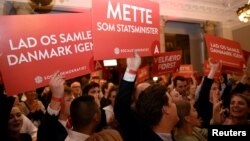 Supporters of Danish Social Democrats celebrate in the parliament in Copenhagen, Denmark, June 5, 2019.