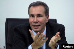 FILE - Argentine prosecutor Alberto Nisman, who is investigating the 1994 car-bomb attack on the Argentine Israelite Mutual Association Jewish community center, is interviewed at his office in Buenos Aires, May 29, 2013.