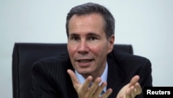 FILE - Argentine prosecutor Alberto Nisman, who is investigating the 1994 car-bomb attack on the Argentine Israelite Mutual Association Jewish community center, is interviewed at his office in Buenos Aires, May 29, 2013. 