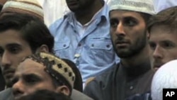Muslim men attending Al-Hidayah 2010 in Britain, which is being billed as an anti-terrorism summer camp.