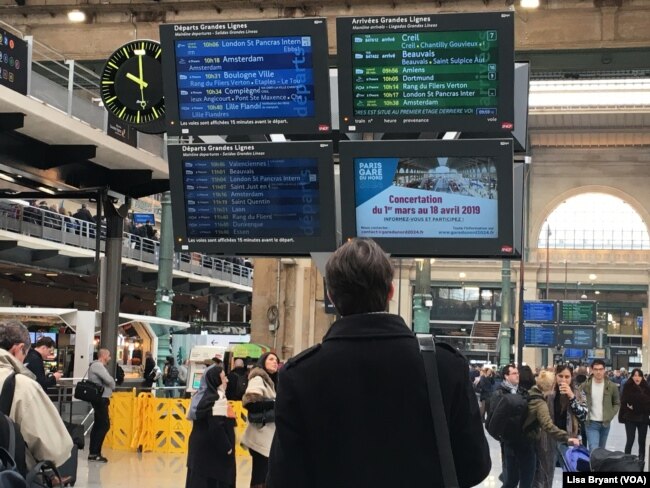 Passengers await trains to northern France and the Netherlands at the Gare du Nord train station in Paris.