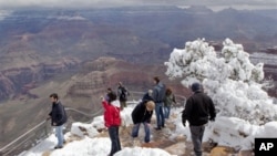 Visitors at the Grand Canyon's Yavapai Point, which is, not surprisingly, in the "Grand Canyon State"