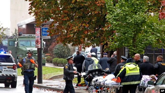 First responders are seen at the Tree of Life Synagogue where a shooter opened fire, In Pittsburgh, Pennsylvania, Oct. 27, 2018, causing multiple casualties.