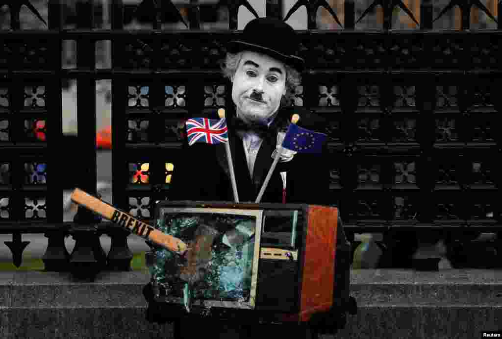 A performer is seen outside the Houses of Parliament, in London, Britain.