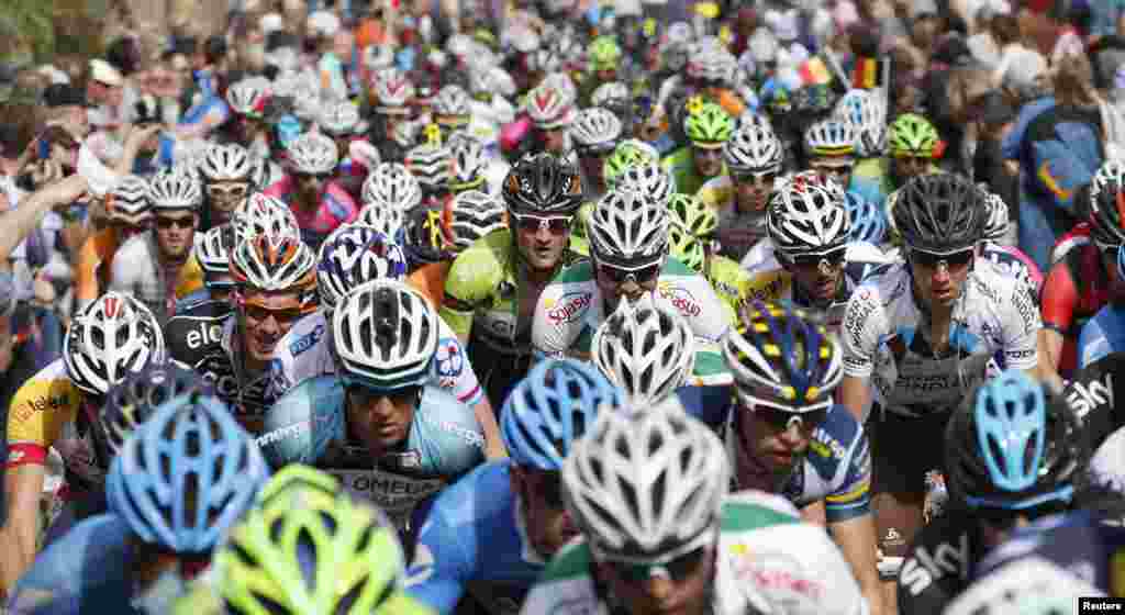 A pack of riders climbs the &quot;Wall of Huy&quot; during the Fleche Wallonne Classic cycling race in Huy, Belgium.