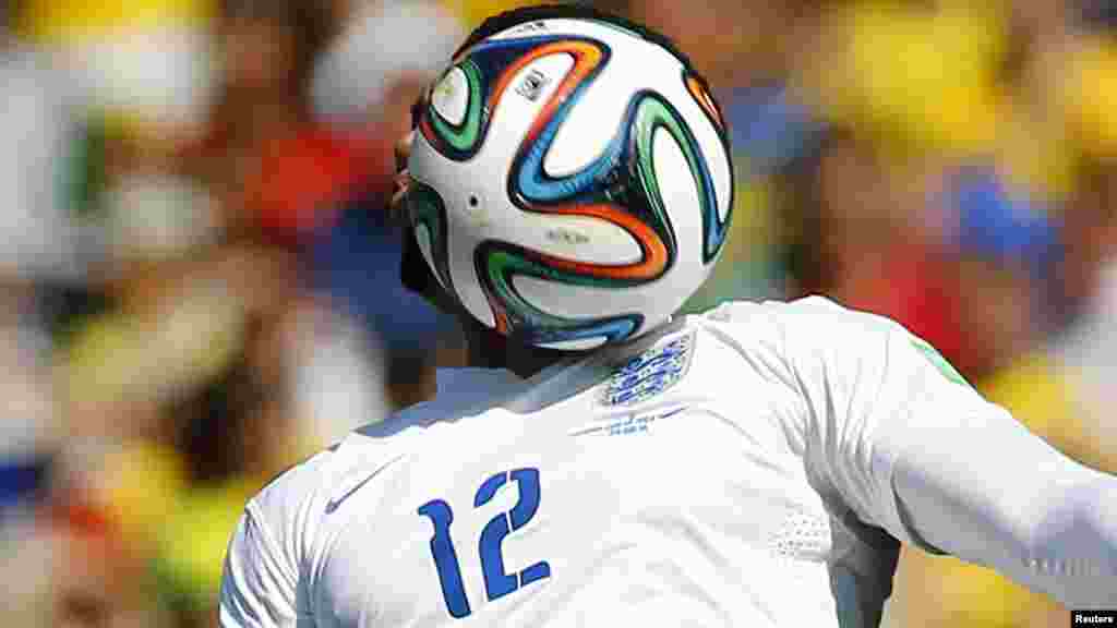 England's Chris Smalling heads the ball during their match against Costa Rica at the Mineirao stadium in Belo Horizonte, June 24, 2014.