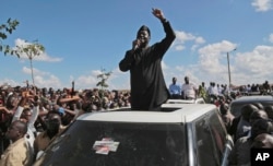 FILE - Kenyan opposition leader Raila Odinga addresses supporters in Nairobi, Kenya, Nov. 28, 2017.