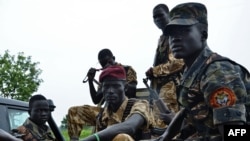 FILE - South Sudanese SPLA soldiers are pictured in Pageri in Eastern Equatoria state, Aug. 20, 2015. The United Nations refugee agency, Feb. 12, 2019, says a surge of violence in Equatoria State has displaced thousands fleeing to the Democratic Republic of Congo.