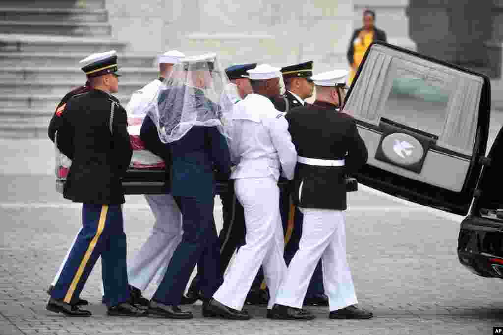 The casket of Sen. John McCain, R-Ariz., is is placed in the hearse at the U.S. Capitol in Washington, Sept. 1, 2018, in Washington, for a departure to the Washington National Cathedral for a memorial service.