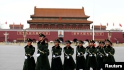 Paramilitary police walk in formation accross Tiananmen Square as the sessions of the National People's Congress are taking place in the nearby Great Hall of the People in Beijing, China, March 6, 2017. 