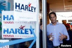 FILE - Harley Rouda speaks to a reporter at a campaign office in Costa Mesa, California, Nov. 3, 2018.