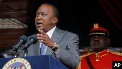 FILE - Kenyan President Uhuru Kenyatta delivers a speech at the Nyayo Nationa Stadium in Nairobi. 