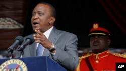 FILE - Kenyan President Uhuru Kenyatta delivers a speech at the Nyayo National Stadium in Nairobi. 