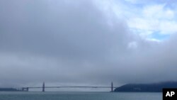 A break in the weather appears over the Golden Gate Bridge, Nov. 28, 2018, in San Francisco, as forecasters predict widespread rain and heavy Sierra Nevada snowfall.