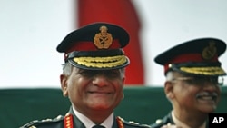 Indian Army Chief Gen. V.K. Singh smiles during a ceremony on the occasion of the Indian Army Day in New Delhi, India, FILE January 15, 2012. 