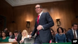 Treasury Secretary Steven Mnuchin arrives on Capitol Hill in Washington, May 18, 2017, to testify at a Senate Banking Committee hearing on tax policy.